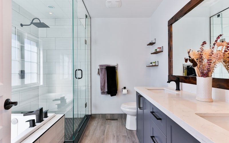 Barton Hills Primary Bath — renovated primary bathroom with a freestanding soaking tub and walk-in shower.