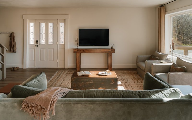 Cedar Park Basement Retreat — finished basement lounge with built-in shelving and a media wall.