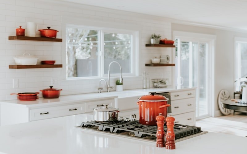 Westlake Kitchen Renewal — remodeled kitchen with white oak cabinetry and a marble-look waterfall island.
